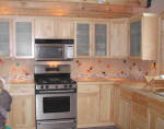 Dichroic glass tile accents in kitchen